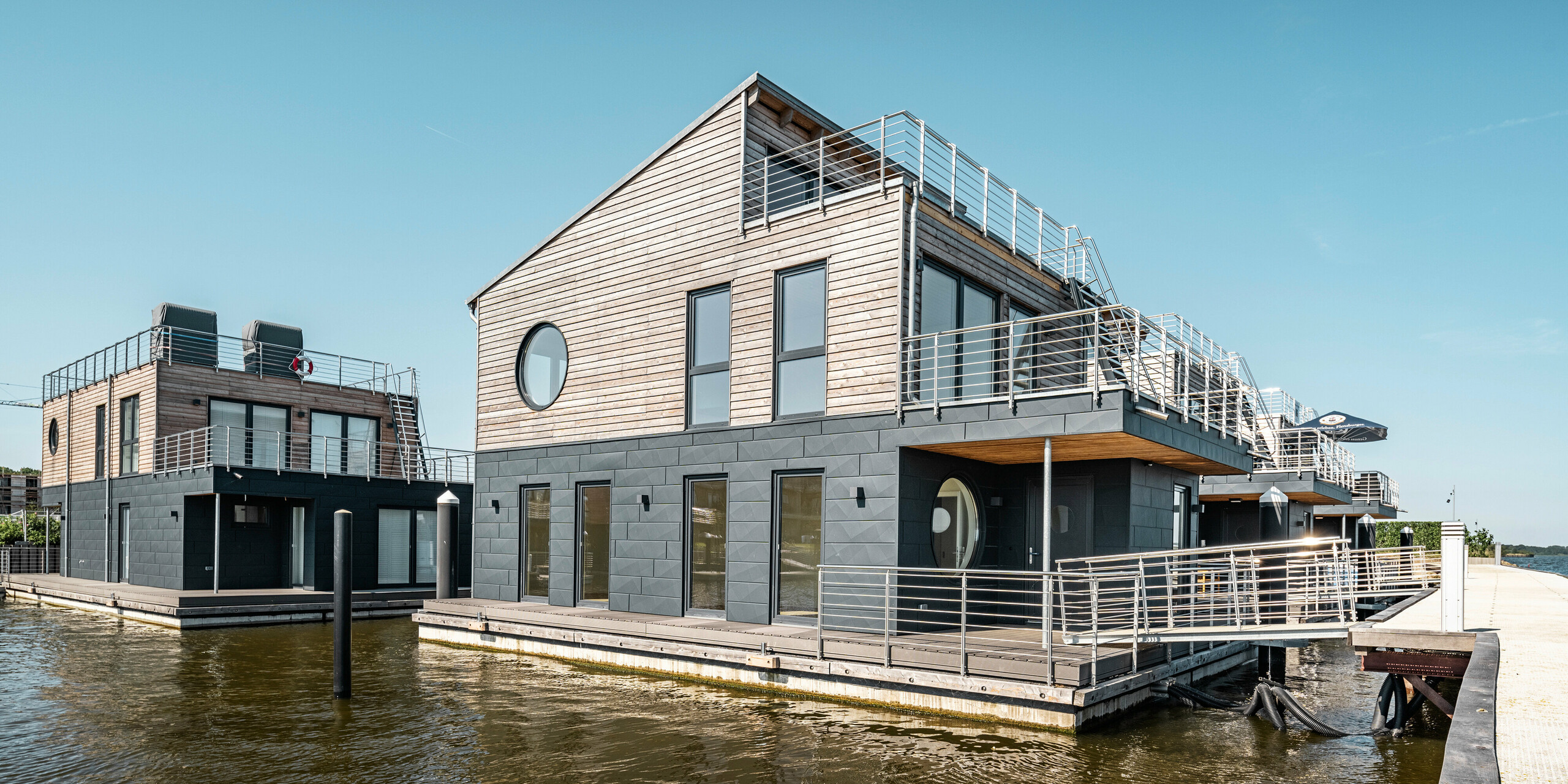 PREFA Siding.X Aluminiumfassade umhüllt elf Wasserhäuser im Pionierhafen Schleswig