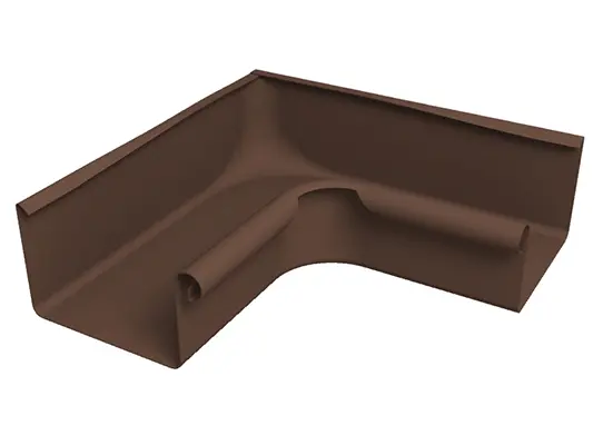 La photo montre une équerre de gouttière carrée 90° (angle rentrant) PREFA en aluminium robuste, couleur brun. Cet accessoire de gouttière durable permet un raccordement propre et étanche des gouttières carrées aux angles rentrants et garantit un écoulement fiable des eaux de pluie. L'équerre est disponible pour les dimensions de gouttières 250, 333, 400 et 500.